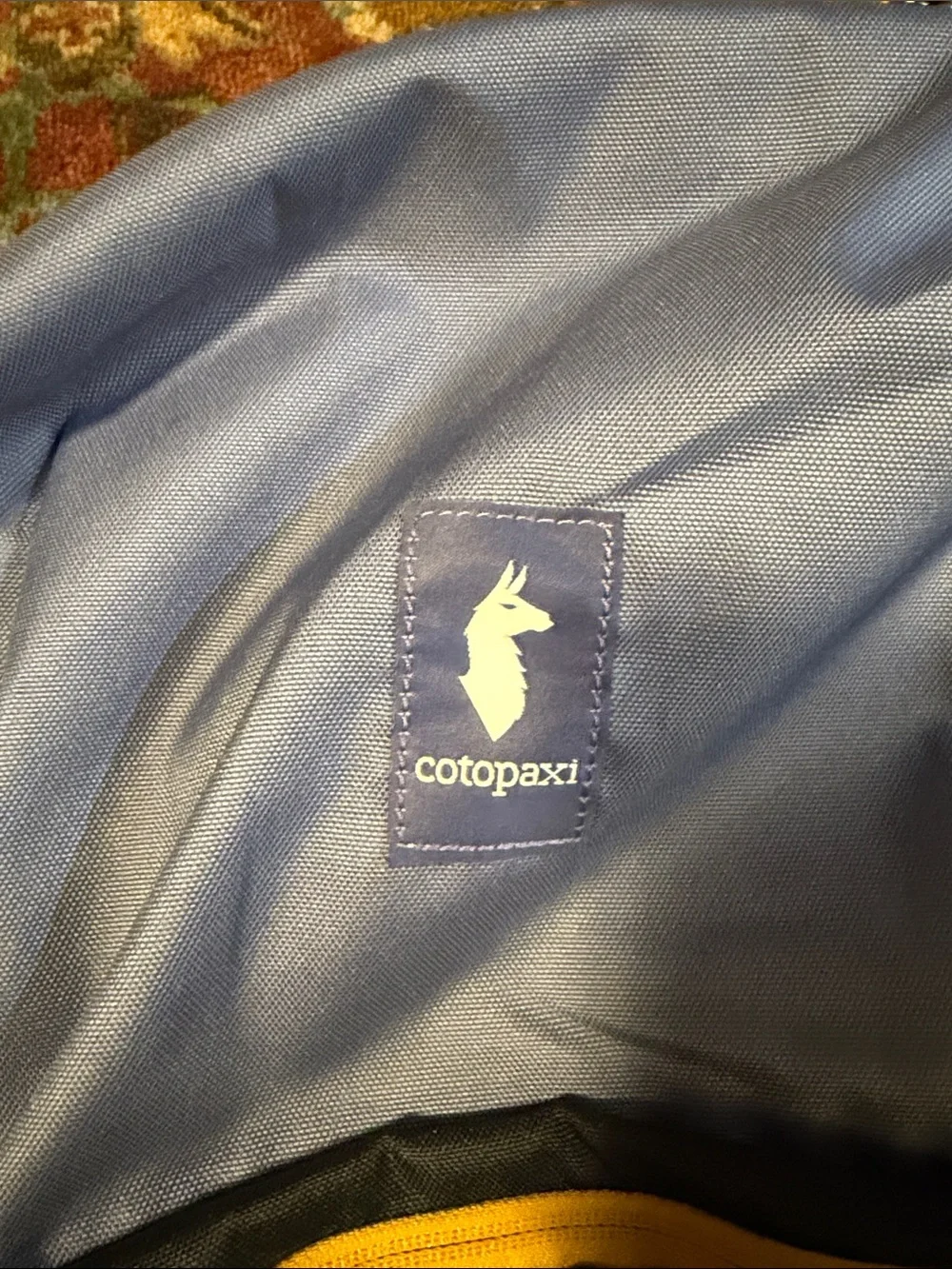 Cotopaxi 26L Chiqullo Blue Smoke Carbon Black Backpack with Yellow Zipper Accent